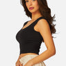 SaltTree Love Poem black seamless cap sleeve tank top with a scoop neckline worn by a model in a studio setting.