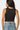 SaltTree Love Poem black sleeveless boatneck top with a smoothing double-layer jersey fit worn by a model