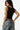 SaltTree Love Poem black double-layered scoop neck tank top worn by a model in blue jeans, back view.