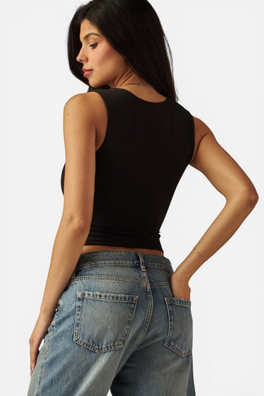 SaltTree Love Poem black double-layered scoop neck tank top worn by a model in blue jeans, back view.