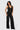 SaltTree Love Poem black waffle-knit two-piece set featuring a button-front vest and high-waisted wide-leg trousers.