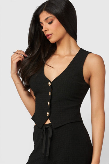 SaltTree Love Poem black waffle-knit button-front vest with V-neckline worn by a model