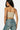 SaltTree Love Poem stone ribbed seamless tube top worn by a model from the back view with blue jeans