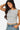 SaltTree Love Poem white sleeveless boatneck top in smoothing double-layer jersey fabric worn by a model