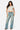 Model wearing a SaltTree Love Poem white double-layered cropped crew neck t-shirt with blue denim jeans