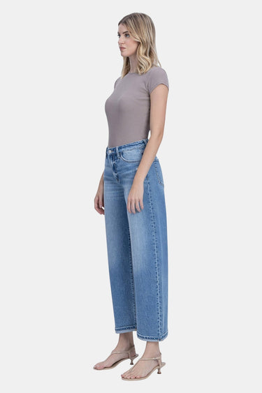 SaltTree medium wash high rise barrel leg jeans made from cotton-lyocell blend with a 1" cuff.