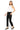 SaltTree model wearing Mica Denim mid-rise ankle straight jeans in solid black with a white tank top and flats.