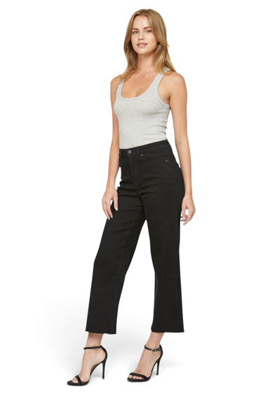 Model wearing SaltTree Mica Denim high rise wide leg cropped black jeans with a grey tank top and black heels.