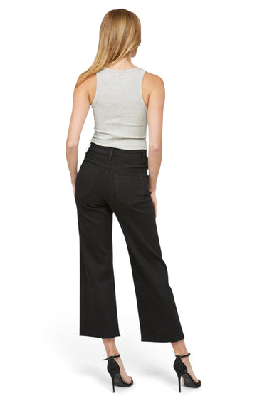 SaltTree Mica Denim high rise wide leg cropped black jeans on a model, back view with a grey tank top and heels.