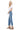 SaltTree Mica Denim high rise crop flare jeans in medium blue with a frayed shark bite hem worn by a blonde model