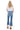 SaltTree Mica Denim high rise crop flare jeans in vintage medium blue with a frayed shark bite hem, back view
