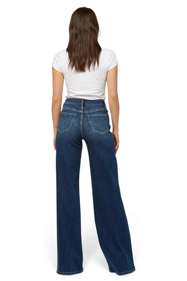 SaltTree mica denim super high rise dark indigo wide leg skater jeans with a 34 inch inseam on a model, back view.