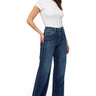 SaltTree model wearing mica denim super high rise dark indigo wide leg skater jeans with a 34 inch inseam