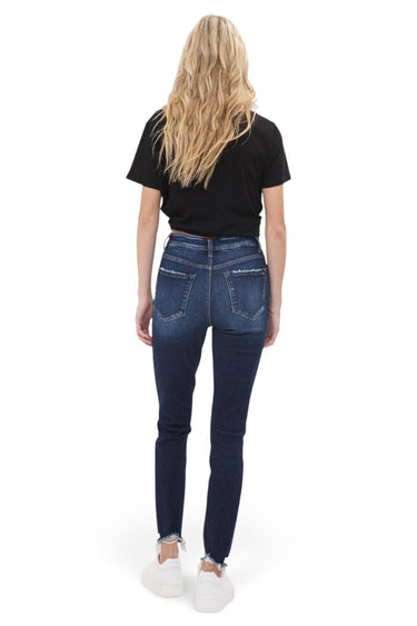 SaltTree Mica Denim Rivale high rise skinny jeans in dark indigo with a raw step hem, viewed from the back.