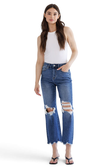 SaltTree model wearing Mica Denim medium blue high-rise vintage crop flare jeans with ripped knees and raw frayed hem
