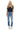 SaltTree model wearing Mica Denim high-rise straight jeans in vintage blue with distressed knees and raw side-slit hem.