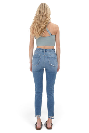 SaltTree Mica Denim high rise cropped skinny jeans in medium blue wash with raw hem seen from the back on a model