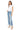 SaltTree model wearing Mica Denim high-rise straight leg jeans in medium-light wash with a folded hem and whiskering.