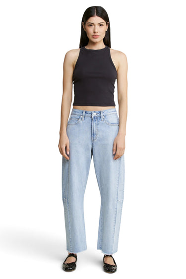 SaltTree Mica Denim super high rise light wash barrel leg jeans with curved seams and raw hem on a model