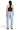 SaltTree Mica Denim light wash barrel leg jeans with curved seams and raw hem, viewed from the back on a model.
