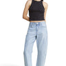 SaltTree Mica Denim light wash super high rise barrel leg jeans with curved seams and raw hem on a model