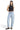 SaltTree Mica Denim light wash super high rise barrel leg jeans with curved seams and raw hem on a model