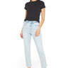Model wearing SaltTree Mica Denim super high rise light wash skinny jeans with a raw hem and black t-shirt