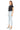 SaltTree model wearing Mica Denim light wash super high rise skinny jeans with a raw hem and black t-shirt