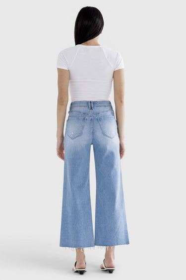 SaltTree Mica Denim light wash super high rise wide leg cropped jeans with raw hem, back view on model