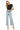 SaltTree Mica Denim high rise wide leg jeans in icy light blue with a raw hem worn by a model in a black top