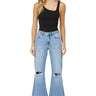 SaltTree Mica Denim light wash high rise super wide leg jeans with distressed knees and raw frayed hem on a model