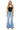 SaltTree Mica Denim light wash high rise super wide leg jeans with distressed knees and raw frayed hem on a model