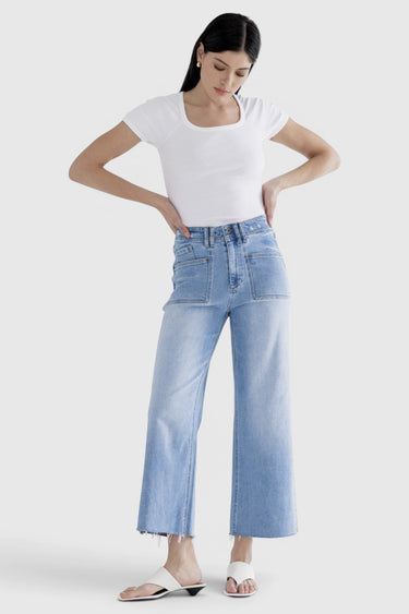 SaltTree model wearing Mica Denim light wash super high rise cropped wide leg jeans with a white ribbed top