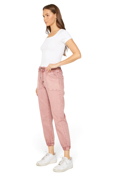 SaltTree model wearing Mica Denim pink high rise jogger cropped pants with cuffed ankles and drawstring waist