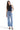 Model wearing SaltTree Mica Denim super high rise wide leg jeans in medium blue wash with a raw hem and 5-pocket style