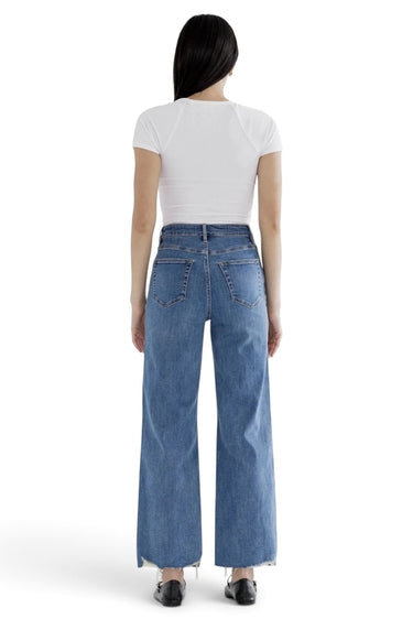 SaltTree Mica Denim high rise wide leg jeans in medium blue with a distressed raw hem seen from the back