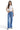 SaltTree model wearing Mica Denim high-rise wide-leg jeans in medium blue indigo with a white cropped t-shirt