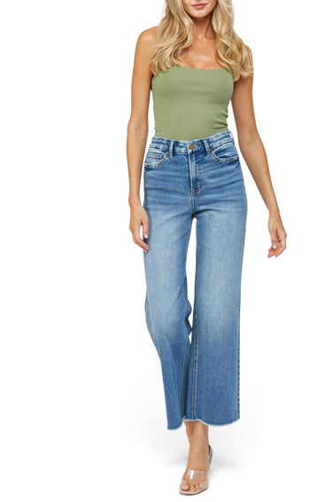 SaltTree Mica Denim super high rise wide leg jeans in vintage medium blue with a frayed raw hem on a blonde model.