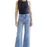 Model wearing SaltTree Mica Denim super high rise wide leg jeans in medium blue wash with a raw hem
