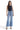 Model wearing SaltTree Mica Denim super high rise wide leg jeans in medium blue wash with a raw hem