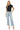 SaltTree model wearing Mica Denim high-rise wide-leg jeans in icy light blue wash with a raw hem and distressed detail