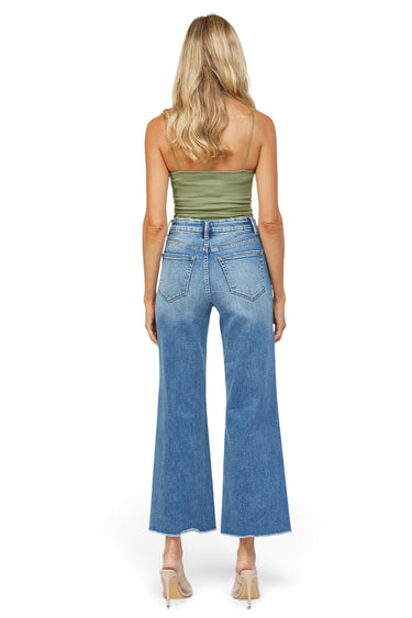 SaltTree Mica Denim super high rise wide leg jeans in vintage medium blue with a frayed raw hem, back view.