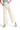 SaltTree Miou Muse high rise wide leg crop pants in off-white stretch twill with a raw hem, worn with platform sandals
