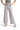 SaltTree Miou Muse high-rise wide-leg cropped pants in light grey stretch twill with a raw hem, worn by a model.