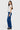 SaltTree model wearing ONE HUNDRED B high rise bootcut jeans in medium wash denim with a 32-inch inseam
