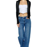SaltTree model wearing ONE HUNDRED B high rise relaxed wide leg jeans in medium denim with stone wash and whiskers