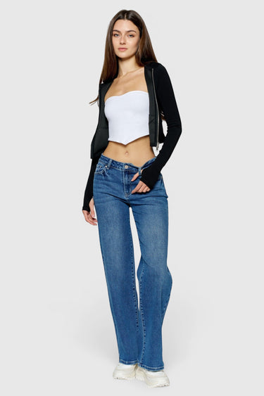 SaltTree model wearing ONE HUNDRED B high rise relaxed wide leg medium wash denim jeans with hand sanding details.