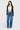 SaltTree model wearing ONE HUNDRED B high rise relaxed wide leg jeans in medium stone wash denim with a white top.