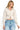 SaltTree Reflex beige fleece cropped zip-up hoodie with drawstring hood worn by a smiling model with blonde hair