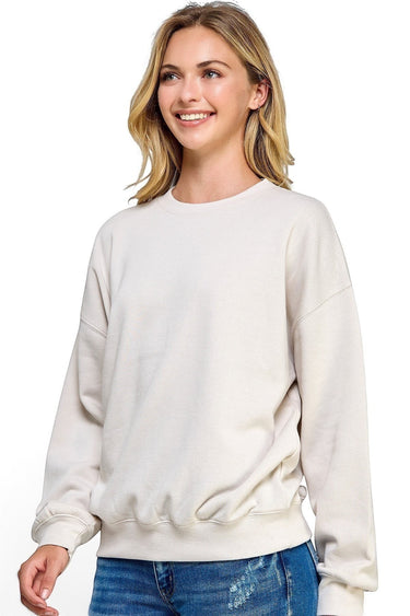 SaltTree Reflex beige relaxed fit fleece crew neck sweatshirt worn by a smiling model with blue jeans